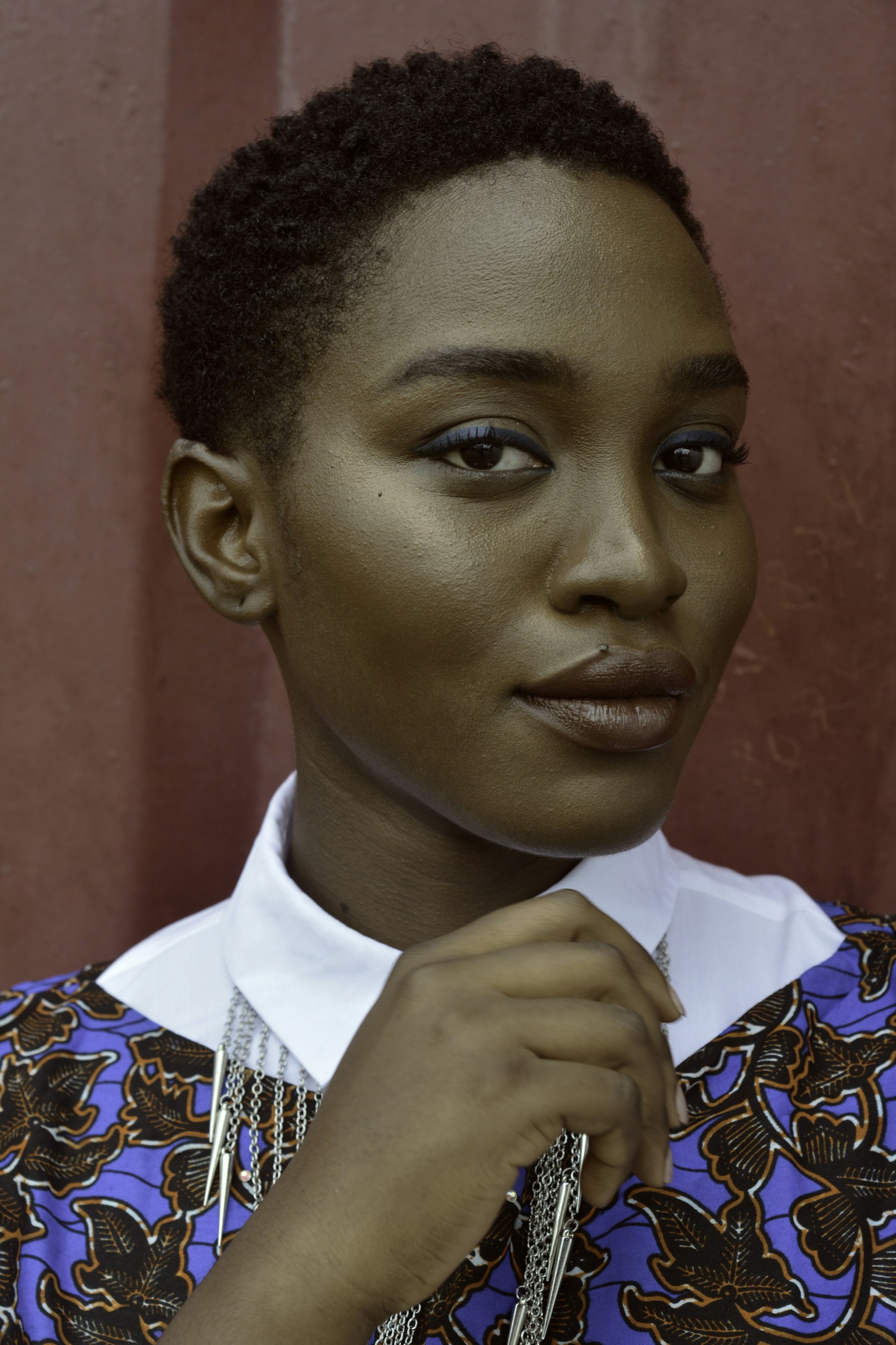 Portrait of a woman in a colourful patterned outfit